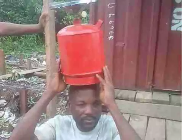 Photos:- Man Who Stole Gas Cylinder In Rivers Stripped, Paraded With It On His Head